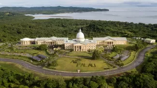 Aerial shot of the National Capitol Complex of Palau. The complex is composed of the  Executive building, Judiciary building, and the  Olbiil Era Kelulau building located in Ngerulmud.